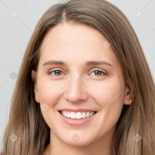 Joyful white young-adult female with long  brown hair and grey eyes