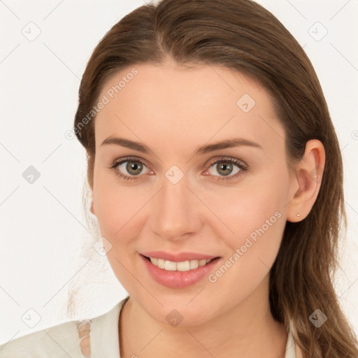 Joyful white young-adult female with long  brown hair and blue eyes