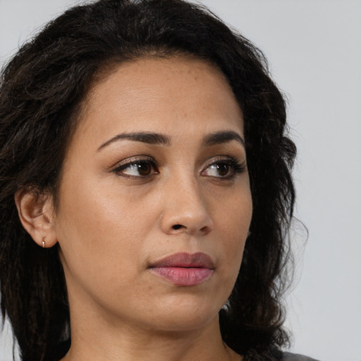 Neutral latino young-adult female with long  brown hair and brown eyes