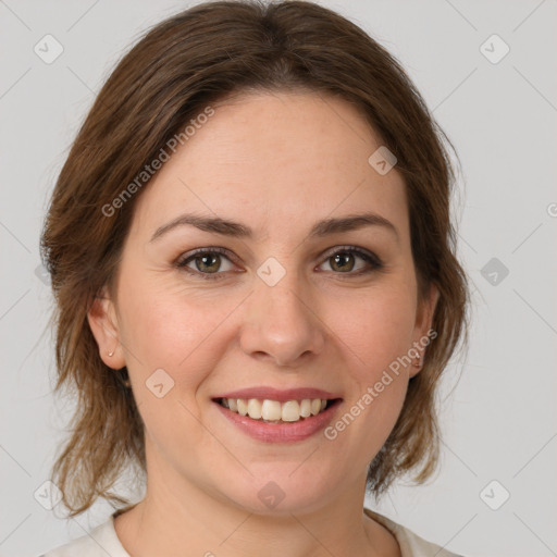 Joyful white young-adult female with medium  brown hair and green eyes