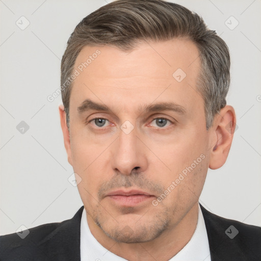 Neutral white adult male with short  brown hair and brown eyes