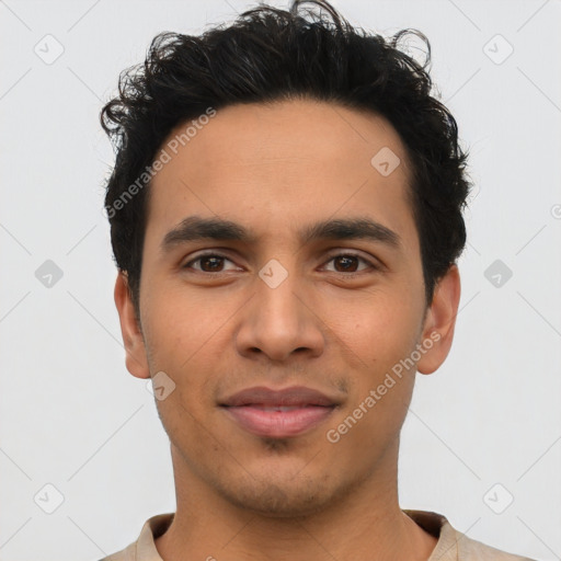 Joyful latino young-adult male with short  brown hair and brown eyes