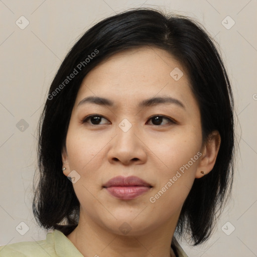 Joyful asian young-adult female with medium  black hair and brown eyes