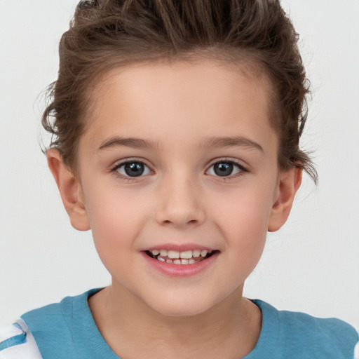 Joyful white child female with short  brown hair and brown eyes