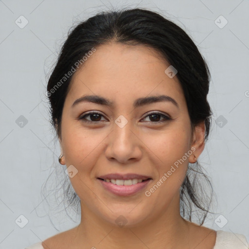 Joyful latino young-adult female with medium  brown hair and brown eyes