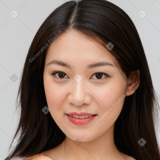 Joyful asian young-adult female with long  brown hair and brown eyes