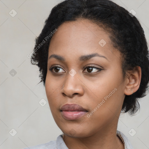 Neutral black young-adult female with short  black hair and brown eyes