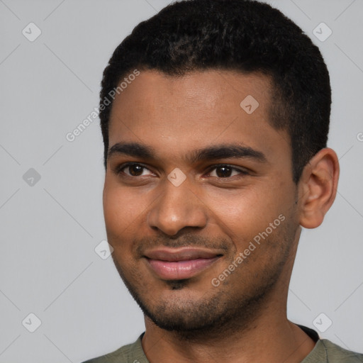 Joyful black young-adult male with short  black hair and brown eyes