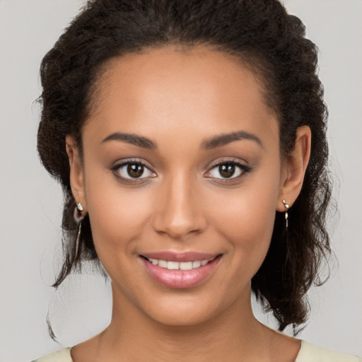 Joyful white young-adult female with medium  brown hair and brown eyes