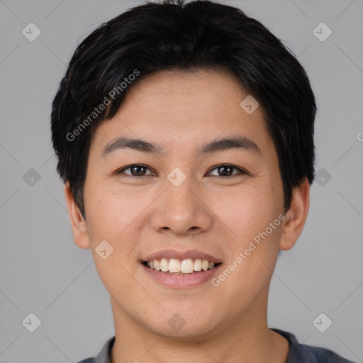 Joyful asian young-adult male with short  brown hair and brown eyes