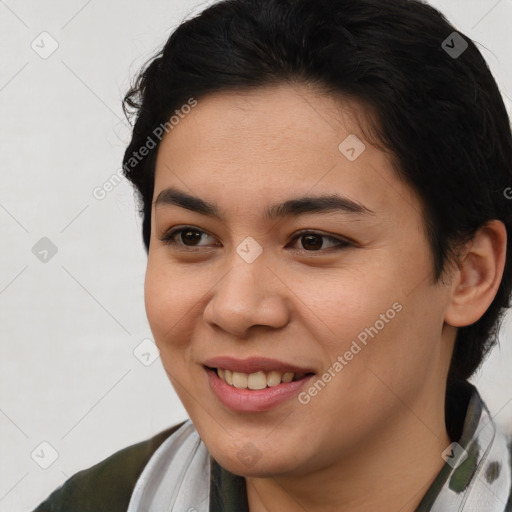 Joyful latino young-adult female with short  brown hair and brown eyes