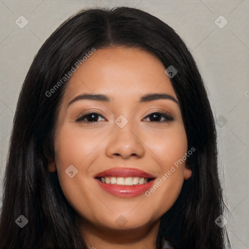 Joyful latino young-adult female with long  black hair and brown eyes