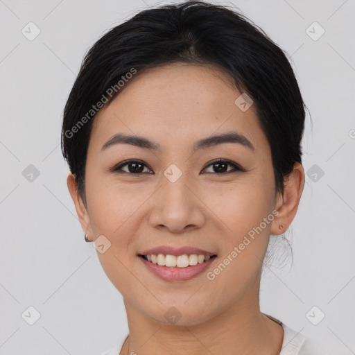 Joyful asian young-adult female with short  black hair and brown eyes