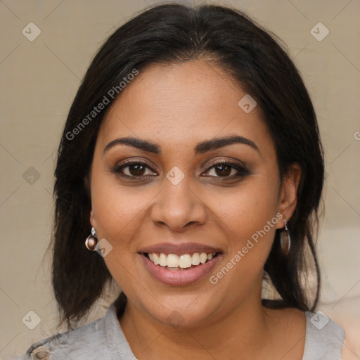 Joyful latino young-adult female with medium  brown hair and brown eyes