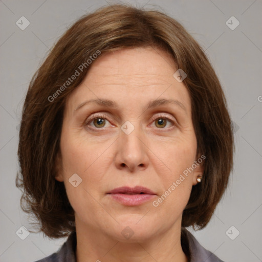 Joyful white adult female with medium  brown hair and grey eyes