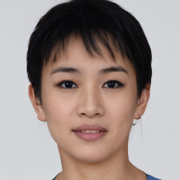 Joyful asian young-adult female with short  black hair and brown eyes