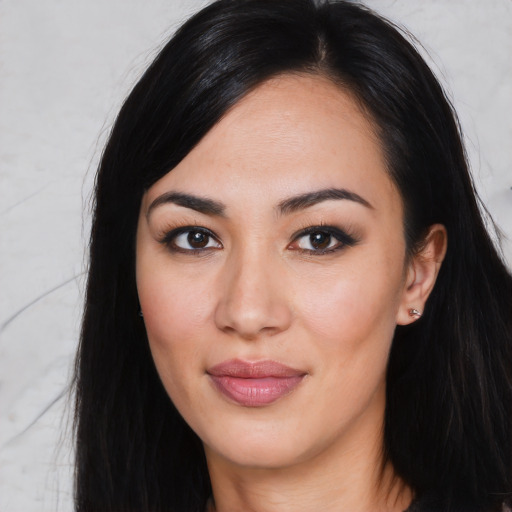 Joyful asian young-adult female with long  black hair and brown eyes