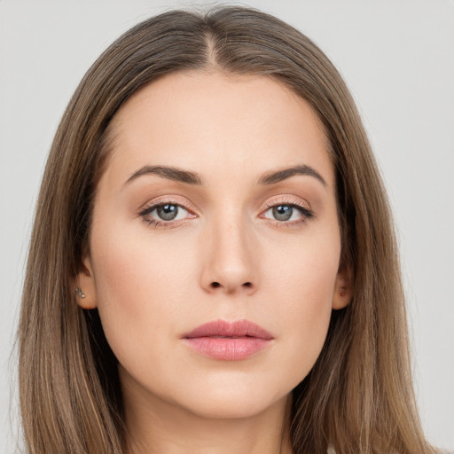 Neutral white young-adult female with long  brown hair and brown eyes