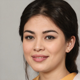 Joyful white young-adult female with medium  brown hair and brown eyes