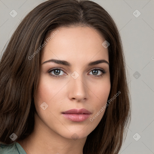 Neutral white young-adult female with long  brown hair and brown eyes