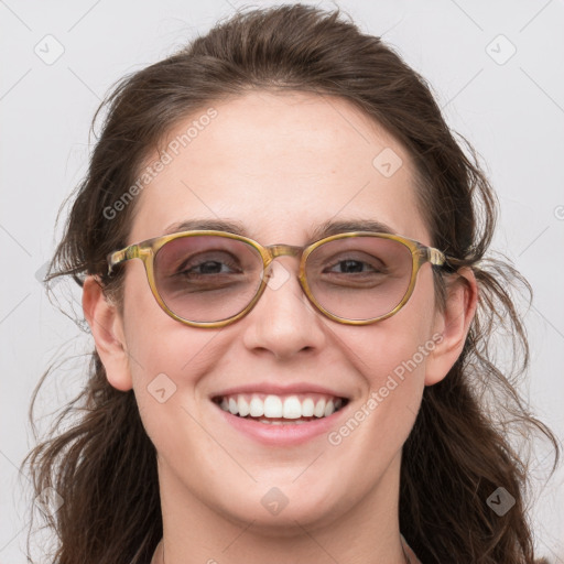 Joyful white young-adult female with long  brown hair and blue eyes