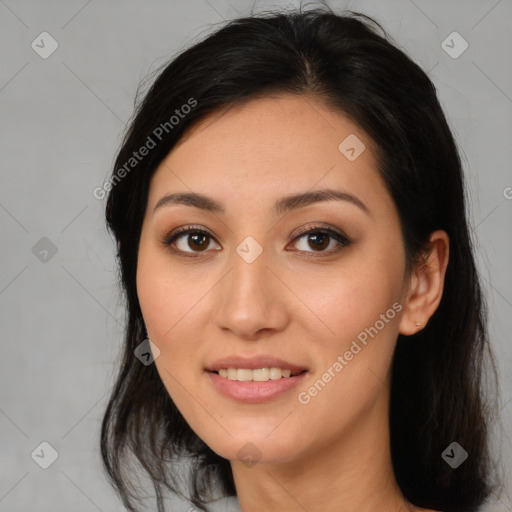 Joyful latino young-adult female with long  brown hair and brown eyes