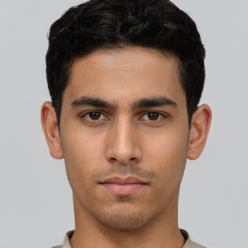 Neutral latino young-adult male with short  brown hair and brown eyes