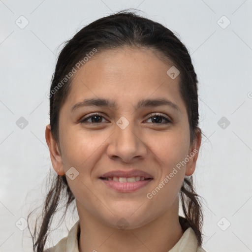 Joyful white young-adult female with long  brown hair and brown eyes