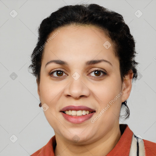 Joyful latino young-adult female with short  brown hair and brown eyes