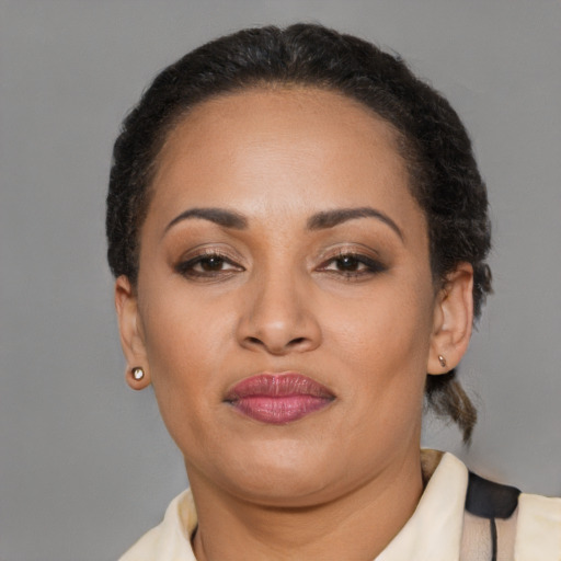 Neutral latino adult female with medium  brown hair and brown eyes