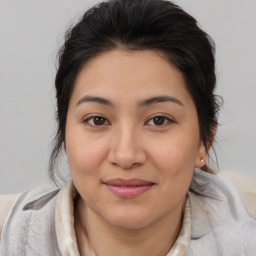 Joyful asian young-adult female with medium  brown hair and brown eyes