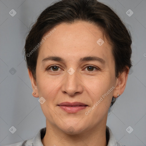 Joyful white adult female with short  brown hair and brown eyes