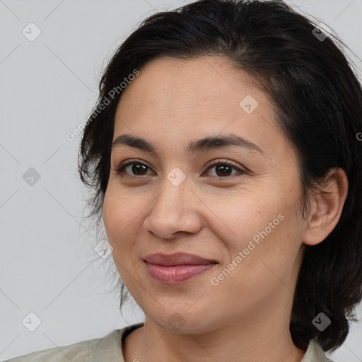 Joyful white adult female with medium  brown hair and brown eyes