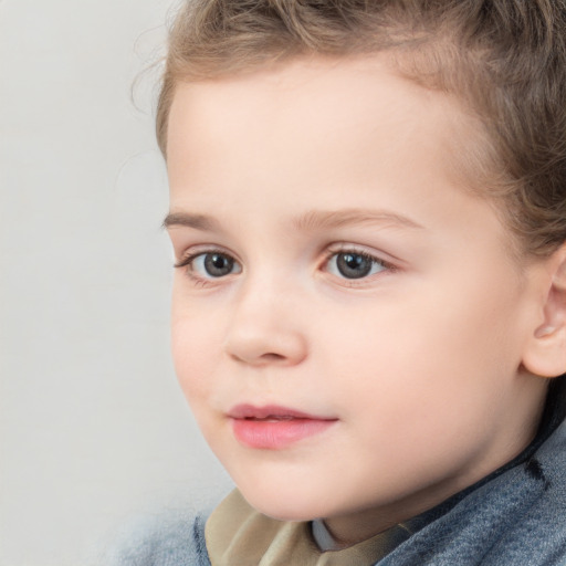 Joyful white child female with short  brown hair and brown eyes