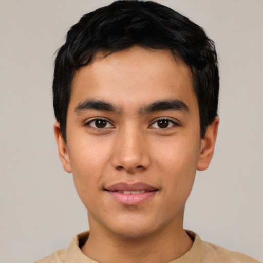 Joyful asian young-adult male with short  black hair and brown eyes