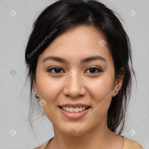 Joyful asian young-adult female with medium  brown hair and brown eyes