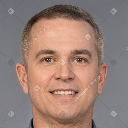 Joyful white adult male with short  brown hair and brown eyes