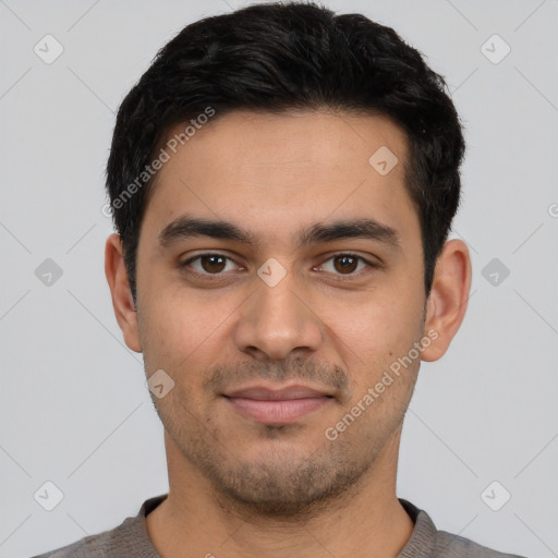 Joyful latino young-adult male with short  black hair and brown eyes