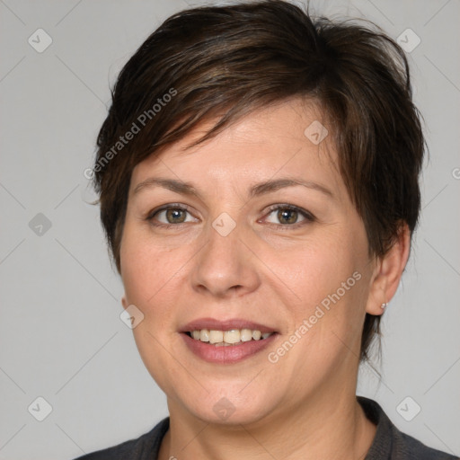 Joyful white adult female with medium  brown hair and brown eyes