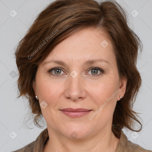 Joyful white adult female with medium  brown hair and grey eyes