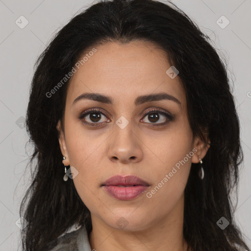 Joyful latino young-adult female with long  brown hair and brown eyes