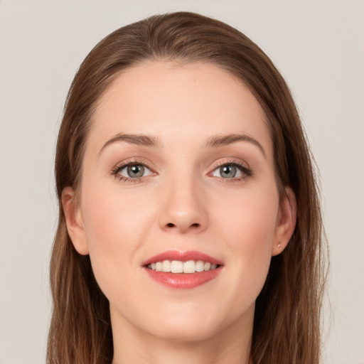 Joyful white young-adult female with long  brown hair and grey eyes