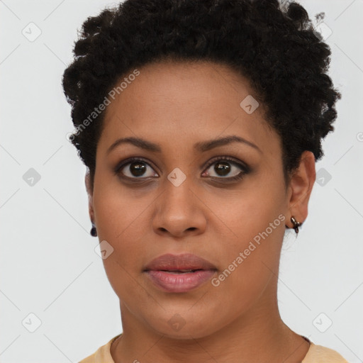 Joyful black young-adult female with short  brown hair and brown eyes