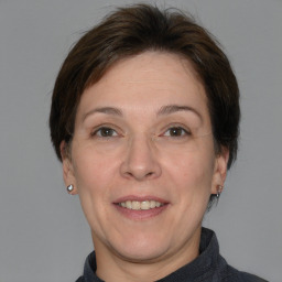 Joyful white adult female with short  brown hair and brown eyes