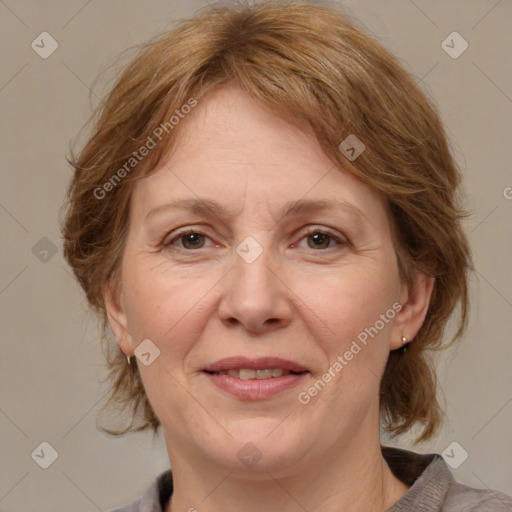 Joyful white adult female with medium  brown hair and grey eyes