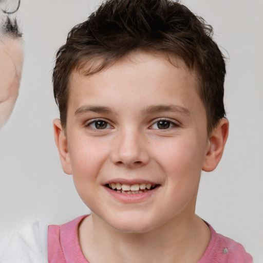 Joyful white child male with short  brown hair and brown eyes