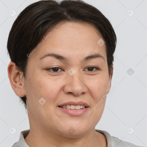 Joyful asian young-adult female with short  brown hair and brown eyes