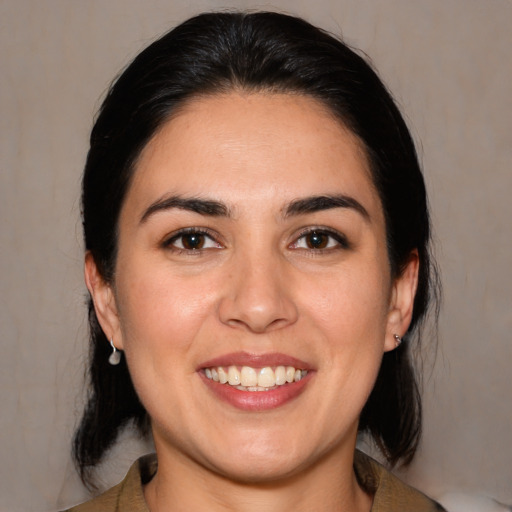 Joyful white young-adult female with medium  black hair and brown eyes