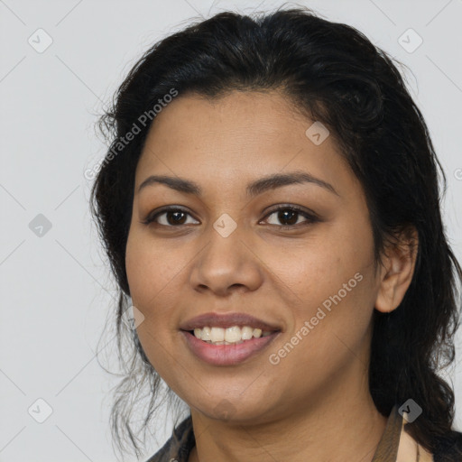 Joyful latino young-adult female with long  brown hair and brown eyes