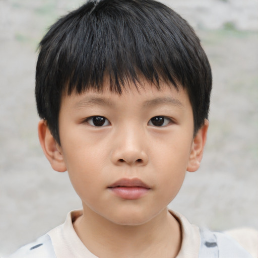 Neutral asian child male with short  brown hair and brown eyes
